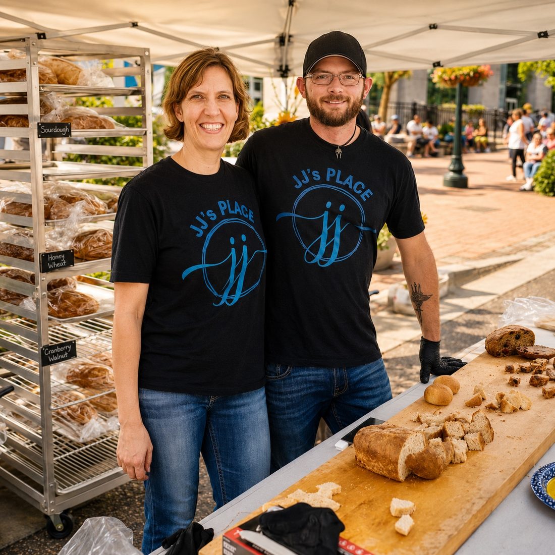 Janice and Andrew, owners of JJ's Place SC, at their Soda City Market booth